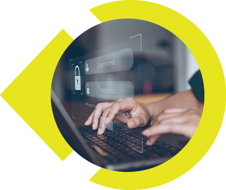 Person typing on a laptop with a holographic login form displaying username and password fields.