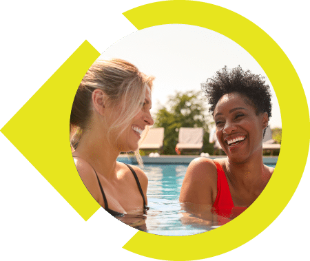Women smiling in the pool